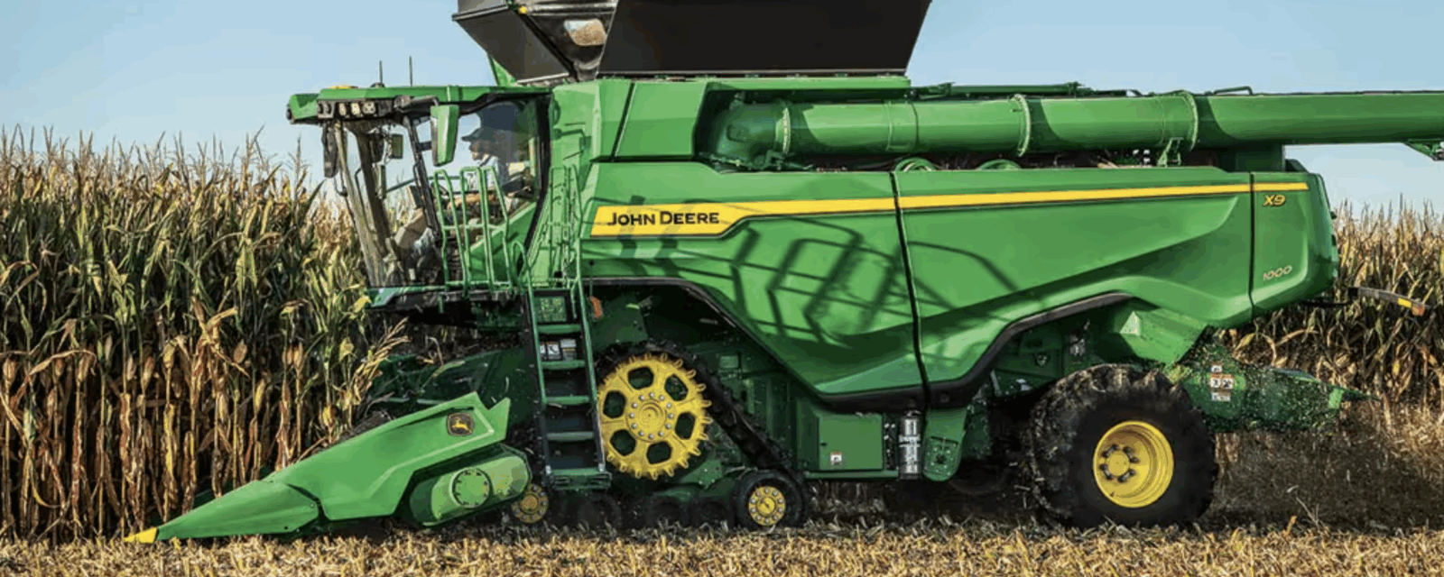 John Deere corn equipment in a field